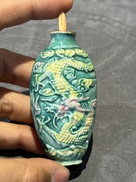 Eight Chinese moulded famille rose snuff bottles, Qianlong mark, 19th C.