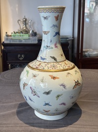 A Chinese famille rose 'butterfly' bottle vase, Guangxu mark and of the period