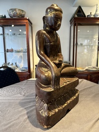 A Burmese lacquered and gilt wooden Buddha, 17/18th C.