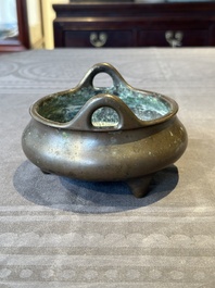 A Chinese bronze tripod censer, Guan Huai Tang Zhu Ren 冠槐堂主人 mark, 17/18th C.