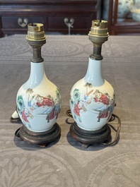 A pair of Chinese famille rose vases with figural design mounted as lamps, 19th C.