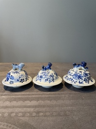 A Chinese blue and white garniture of five vases with lotus scrolls, 19th C.