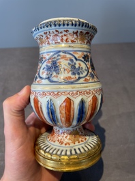 A pair of Chinese Imari-style casters or vases with gilt bronze mounts, Kangxi