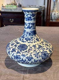 A Chinese blue and white 'lotus scroll' bottle vase, 18/19th C.