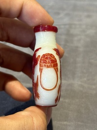 A group of six Chinese overlay glass snuff bottles, 19th C.