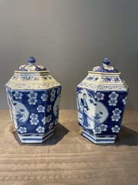 A pair of Chinese blue and white hexagonal jars and covers with a lady holding a fan, 19th C.