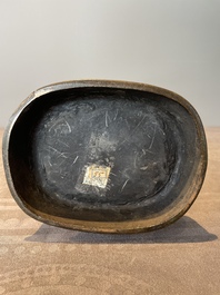A pair of Chinese bronze 'hu' vases with Taotie design, Song/Yuan
