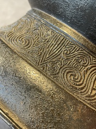 A pair of Chinese bronze 'hu' vases with Taotie design, Song/Yuan