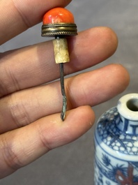A Chinese blue, white and copper-red snuff bottle, Kangxi mark, 19th C.