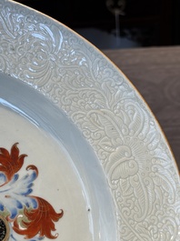 A Chinese famille rose armorial dish with incised rim for the English market with the arms of Willes Impaling Broster, Qianlong