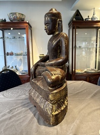 A Burmese lacquered and gilt wooden Buddha, 17/18th C.