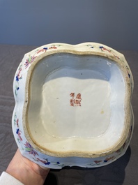 A Chinese blue, white and famille rose tea service, three famille rose bowls, a plate and a covered jar, 19th C.