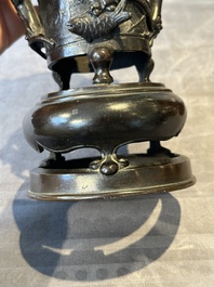 Two Chinese Chinese bronze cylindrical incense stick holders and a covered censer, Yuan/Ming and Qing