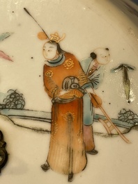 A pair of Chinese famille rose jars and covers with figures in a garden, Tongzhi mark and of the period