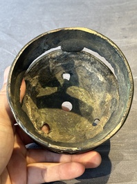 Two Chinese Chinese bronze cylindrical incense stick holders and a covered censer, Yuan/Ming and Qing