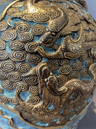 A pair of Chinese robin's egg and faux bronze-glazed 'hu' vases, Qianlong mark, 19th C.
