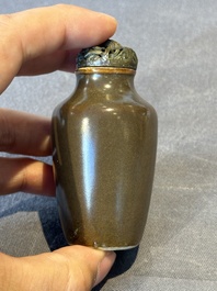 A rare Chinese monochrome teadust-glazed snuff bottle with a bronze 'dragon' stopper, 18/19th C.