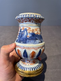 A pair of Chinese Imari-style casters or vases with gilt bronze mounts, Kangxi