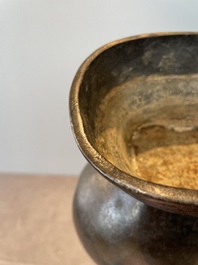 A pair of Chinese bronze 'hu' vases with Taotie design, Song/Yuan