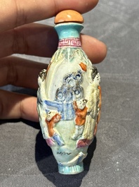 Eight Chinese moulded famille rose snuff bottles, Qianlong mark, 19th C.
