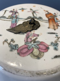 A pair of Chinese famille rose jars and covers with figures in a garden, Tongzhi mark and of the period