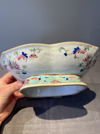 A Chinese blue, white and famille rose tea service, three famille rose bowls, a plate and a covered jar, 19th C.