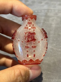 A group of six Chinese overlay glass snuff bottles, 19th C.