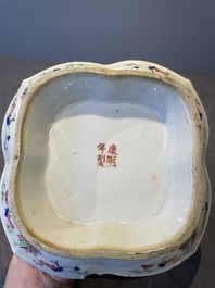 A Chinese blue, white and famille rose tea service, three famille rose bowls, a plate and a covered jar, 19th C.