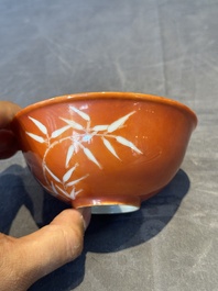A Chinese coral-red-glazed bowl with reverse-decorated bamboo design, Xuantong mark and of the period
