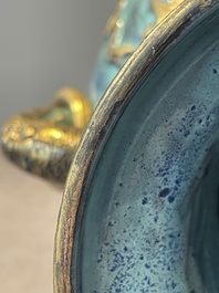 A pair of Chinese robin's egg and faux bronze-glazed 'hu' vases, Qianlong mark, 19th C.