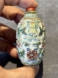 Six Chinese famille rose moulded snuff bottles, Qianlong mark, 19/20th C.