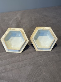 A pair of Chinese blue and white hexagonal jars and covers with a lady holding a fan, 19th C.