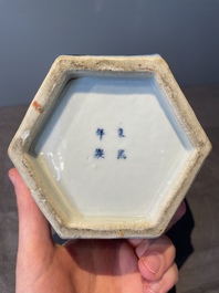 A pair of Chinese blue and white hexagonal jars and covers with a lady holding a fan, 19th C.