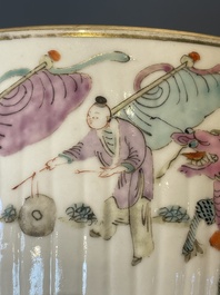 A pair of Chinese famille rose jars and covers with figures in a garden, Tongzhi mark and of the period