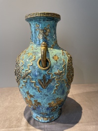A pair of Chinese robin's egg and faux bronze-glazed 'hu' vases, Qianlong mark, 19th C.