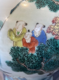 A pair of Chinese famille rose 'hundred boys' vases and covers on wooden stands, 19th C.