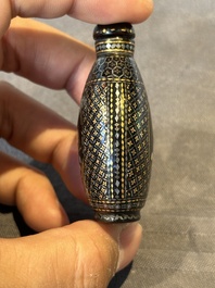 Two Chinese lacquered and mother-of-pearl-inlaid snuff bottles and a carved mother-of-pearl shell snuff bottle, Qianlong mark, 18/19th C