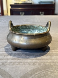 A Chinese bronze tripod censer, Guan Huai Tang Zhu Ren 冠槐堂主人 mark, 17/18th C.
