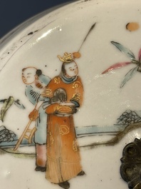 A pair of Chinese famille rose jars and covers with figures in a garden, Tongzhi mark and of the period