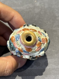 Eight Chinese moulded famille rose snuff bottles, Qianlong mark, 19th C.