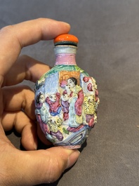 Six Chinese moulded famille rose snuff bottles, Qianlong mark, 19th C.