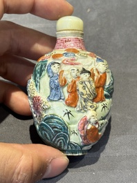 Eight Chinese moulded famille rose snuff bottles, Qianlong mark, 19th C.