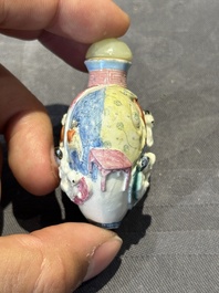 Eight Chinese moulded famille rose snuff bottles, Qianlong mark, 19th C.
