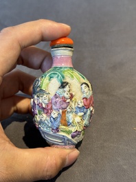 Six Chinese moulded famille rose snuff bottles, Qianlong mark, 19th C.