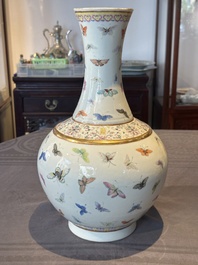 A Chinese famille rose 'butterfly' bottle vase, Guangxu mark and of the period
