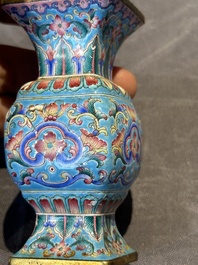 A Chinese Canton enamel 'gu' vase with floral design, Qianlong mark and of the period