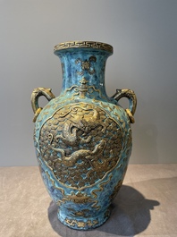 A pair of Chinese robin's egg and faux bronze-glazed 'hu' vases, Qianlong mark, 19th C.