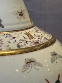 A Chinese famille rose 'butterfly' bottle vase, Guangxu mark and of the period