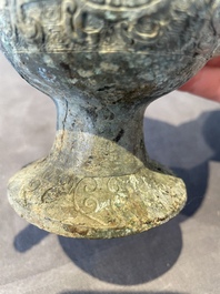 Three Chinese archaic bronze wine vessels, Zhou or later