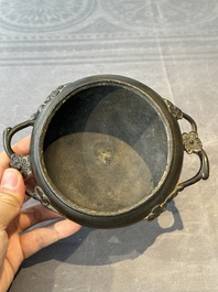 Two Chinese Chinese bronze cylindrical incense stick holders and a covered censer, Yuan/Ming and Qing